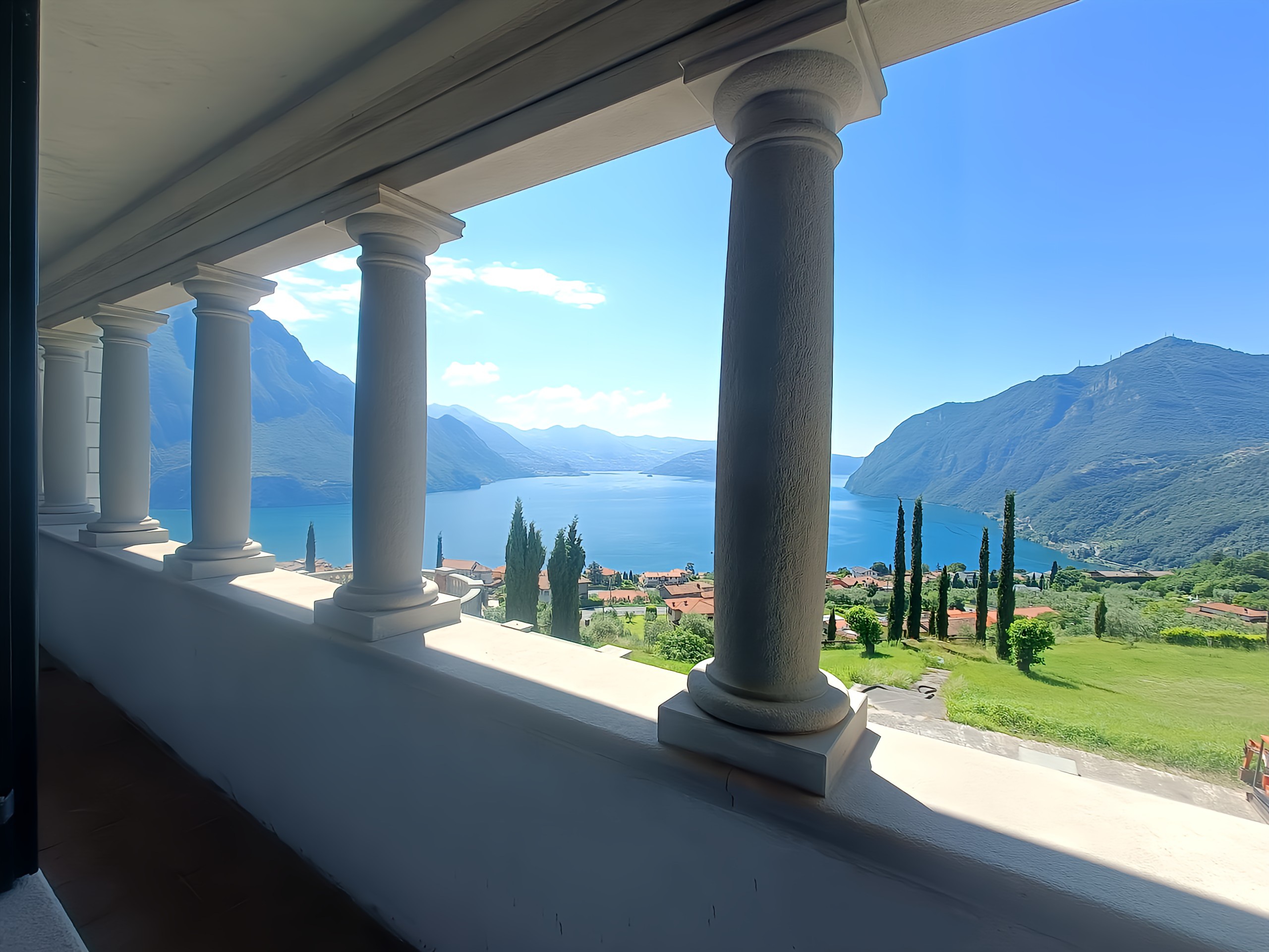 Stone arched loggia with lake view, Villa Hélène Lake Iseo Italy